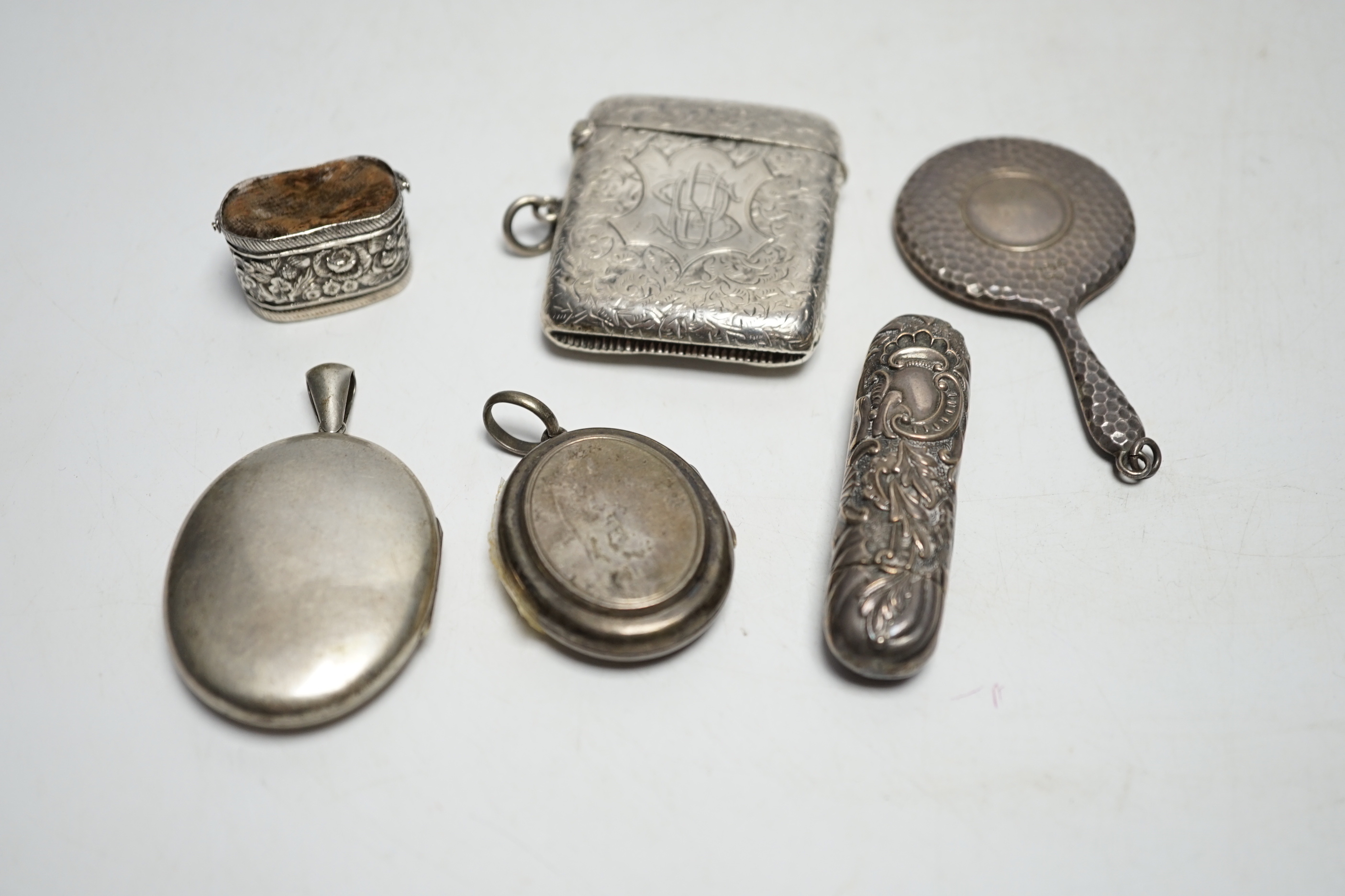 Sundry small silver and white metal items including a George V handbag mirror, vesta case, needle case, basket pin cushion, etc.